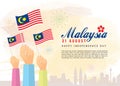 31 August, Malaysia Independence Day - citizen holding Malaysia flags with city skyline